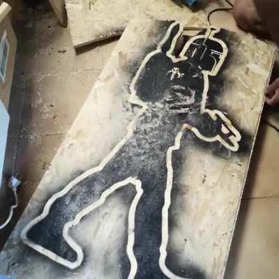 I wanted to find the coolest way to hang my extinguisher in my woodshop... I think I found it :)