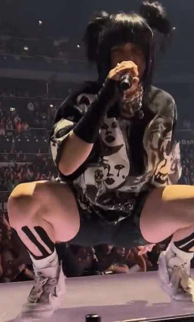 Slowed down leg spread bounce on stage