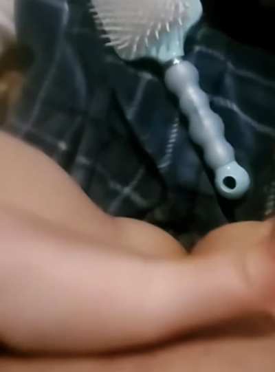 Pounding herself with her brush makes her squirt