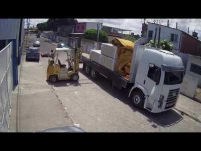 biker rides into forklift