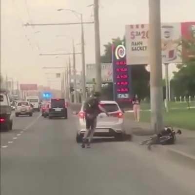 Driver tries to smash bike rider
