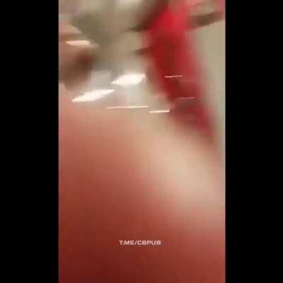 Hanging naked upside down from the pole in the train