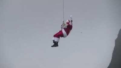 Santa Claus abseils down Brazil's Sugarloaf Mountain in Rio de Janeiro