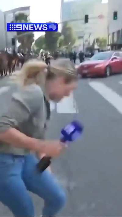 LAPD shot an Australian news reporter in the leg with a fucking rubber bullet.