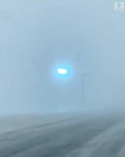 Cellphone footage shows power lines flashing as blizzard sweeps through Minnesota