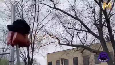 Reddit moderator is proud of his pig head on a pike while he's visibly uncomfortable with the protesters behind him.