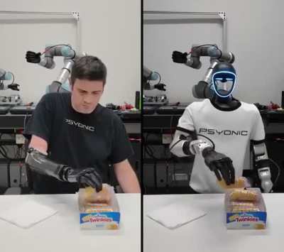 A human operator uses the PSYONIC Ability Hand to pick up a soft, deformable object
