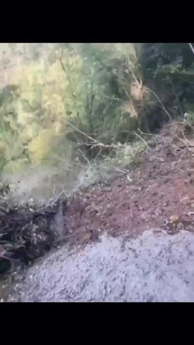 Concrete truck tumbles down hill