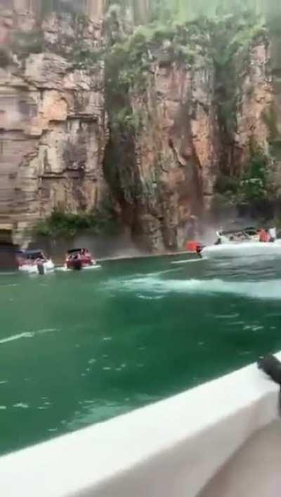 cliff collapses on a boat full of people