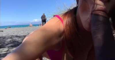 Naughty blowjob on public beach
