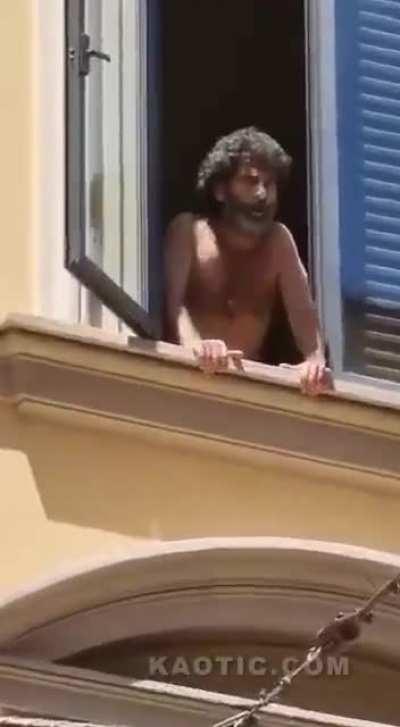 Man jumps from 3rd floor in an attempt to kick someone's ass below.