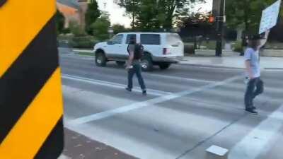 Video shows vehicle being surrounded in Provo, Utah & shot at as driver attempts to escape.