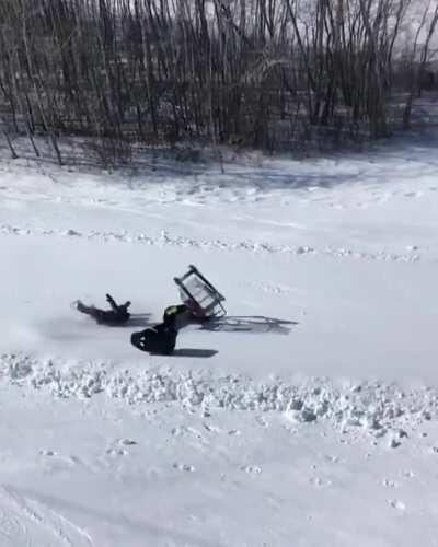 WCGW going down a ski slope in a shopping cart