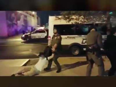 Protester walking to his car gets grabbed and dragged away by police unprovoked.