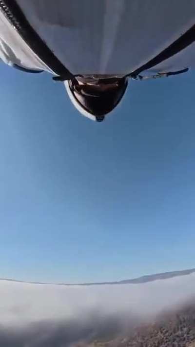 Flying through a gap in the bridge support.