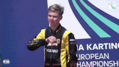 Russian driver, 15, under investigation, apologizes but denies making Nazi salute atop podium