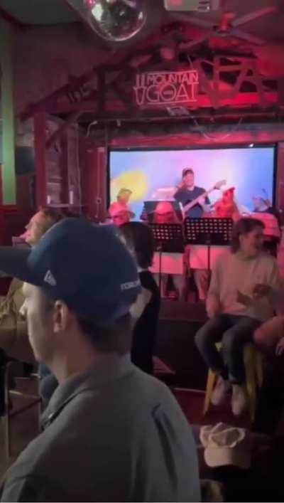 Band plays Mario Kart soundtrack live to bar patrons playing the game