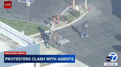 A military Blackhawk helicopter is unloading dozens of boxes of weapons and ammunition in Los Angeles “as if they were getting ready for a major battle.”