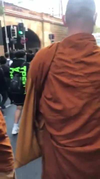 A new challenger appears: Buddhist monks have now joined the protests.