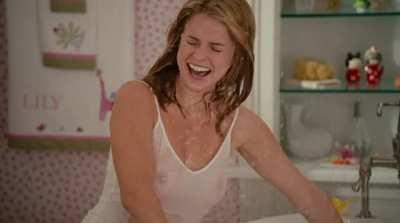 Alice Eve's jiggling tits on display through her wet shirt