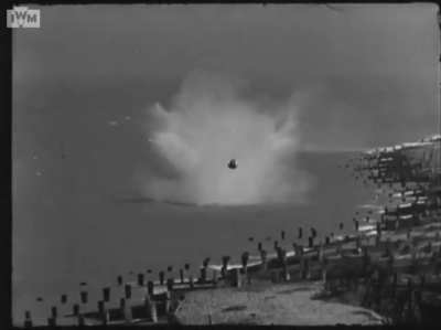 Cameraman hangs in there when highball bouncing antiship bomb goes off course and comes at him during test