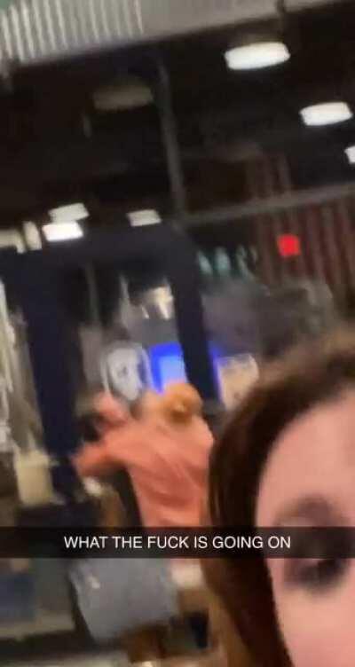 At a public bar, in front of all the customers and workers.