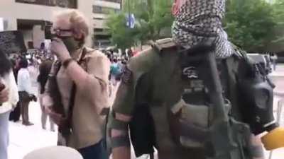 An interview with an armed protester in Minnesota. He states that a group has formed.