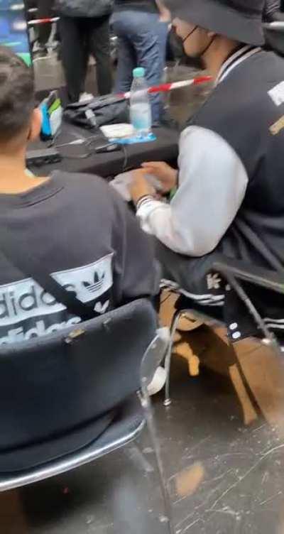 He is playing with a N64 Controller at a Smash Tournament