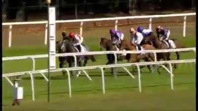 Jockey elbows rival Jockey off of horse.