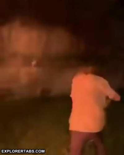 Spitting accelerant point blank into a fire