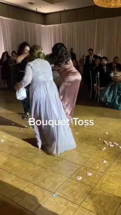 Taking the bouquet toss a little too serious!