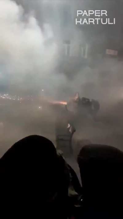GEORGIA: Protesters respond with firework machine gun against police water cannons