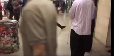 MMA fighter (long hair) fights guy who threatnend him in NYC public mall