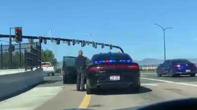 Lady attempts to run from police on the highway. Finally pulls off an exit and proceeds argue with the officer, flailing her keys and slamming his door... gets tazed