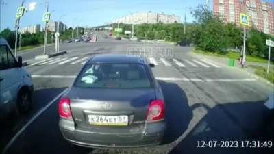 The driver drove through the intersection at a red traffic light.