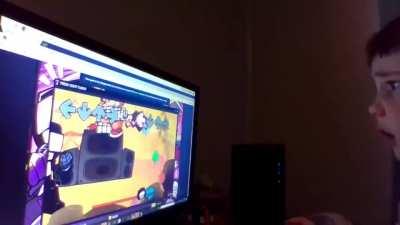 Kid almost breaks computer while on newgrounds