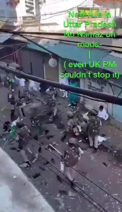 indian police beating muslims for praying in the street