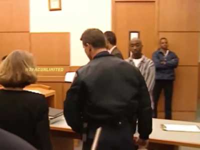 Tupac in court staring down the two cops he shot (1993).
