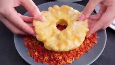 Mac and cheese donut with chip crumbs on top