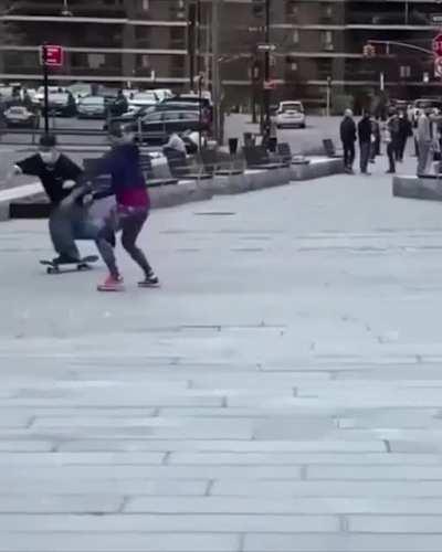 This woman tries to stop a guy from skating in order to protect her city lmao