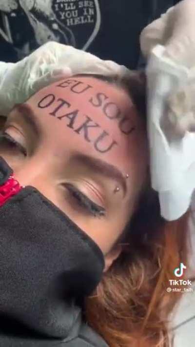 Teen couple tattooing 