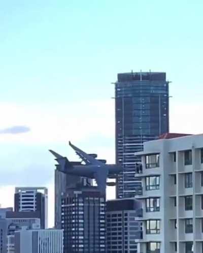 Flying a Boeing C-17 Globemaster through the middle of the city.