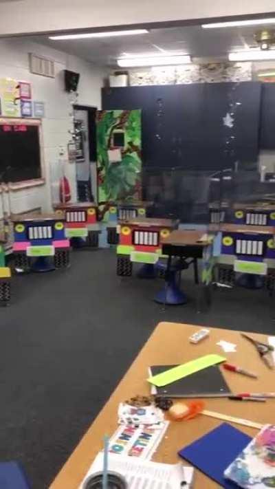 A first grade teacher didn't want her classroom to look scary to children because of the dividers so she did this...