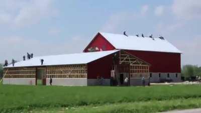Amish building a house in a day.