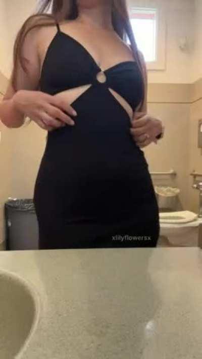 Tight dress hugging her curves
