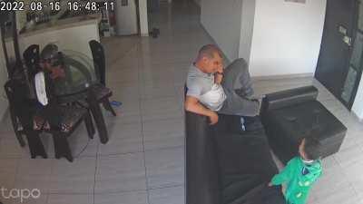 Kid kicks phone out of Dad's hand