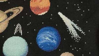 I made the Solar System in cross stitch :-D