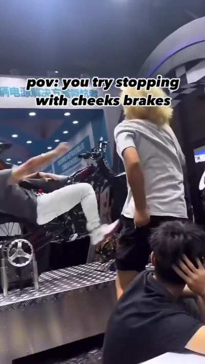 guy gets lodged between the bike wheel and chassis