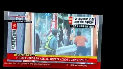 NHK is broadcasting the moment that Japanese Former PM Shinzo Abe was shot from behind. Video does not show the shooter, just the puff of smoke.