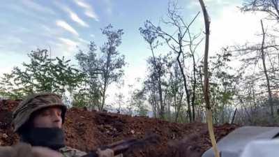 Ukrainian soldier drinking coffee while in a gunfight somewhere between Lyman and Bakhmut